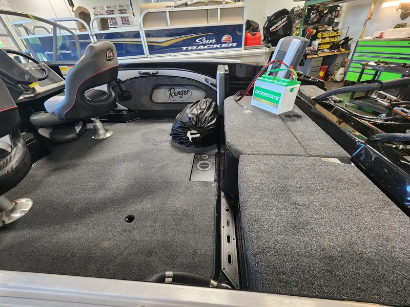 Slide: The Image of 2025 Ranger 1880MS boat interior with seating, storage, and battery setup. - 7