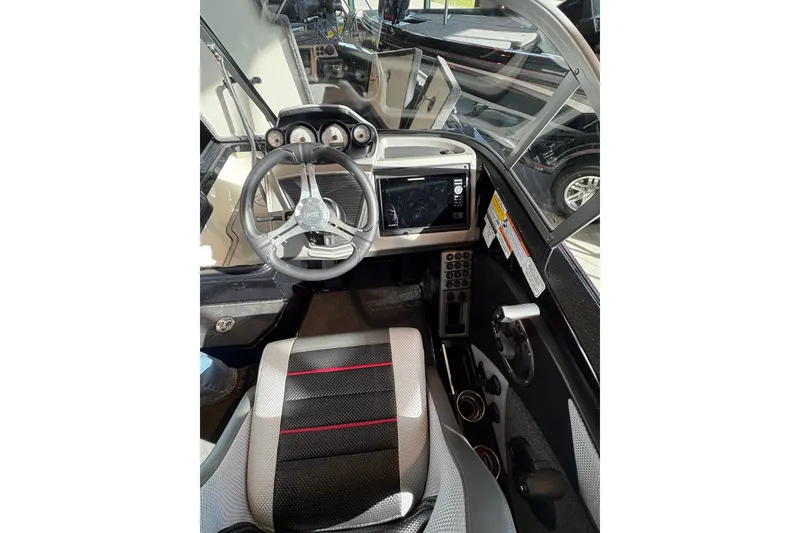 Slide: The Image of Interior view of 2025 Ranger 1880MS boat cockpit with steering wheel and control panel. - 10
