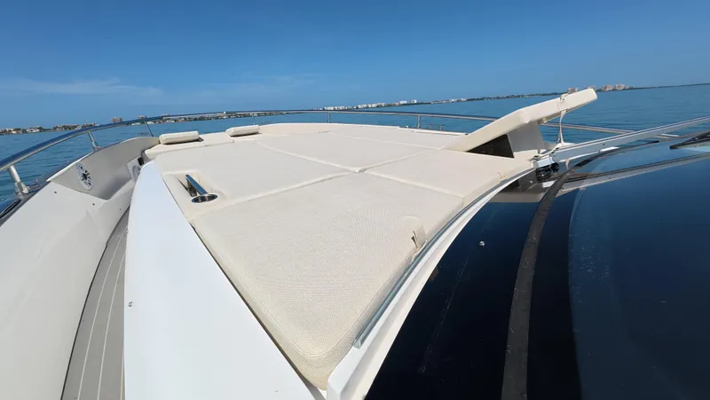 Slide: The Image of 2022 Azimut Verve 47 yacht deck with sunbed, ocean view. - 12