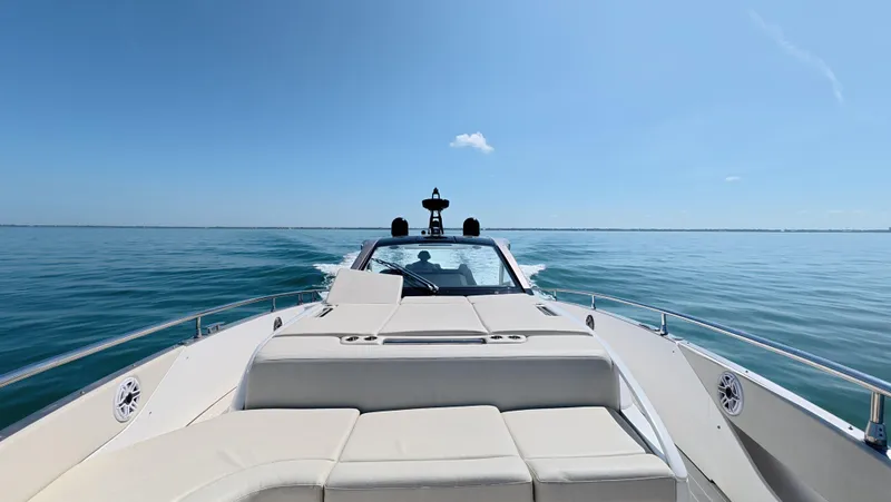 Slide: The Image of 2022 Azimut Verve 47 cruising on calm blue waters under a clear sky. - 16