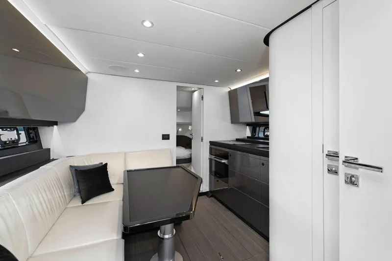 Slide: The Image of Luxurious interior of 2022 Azimut Verve 47 yacht with modern kitchen and seating area. - 2