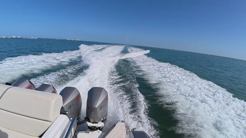 Slide: The Image of 2022 Azimut Verve 47 cruising on open water, leaving a wake behind. - 21