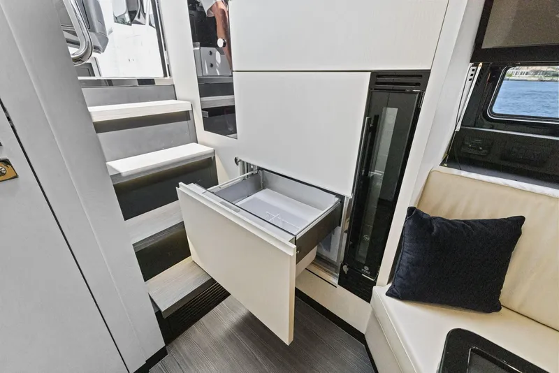 Slide: The Image of Interior of 2022 Azimut Verve 47 yacht with open drawer and seating area. - 26