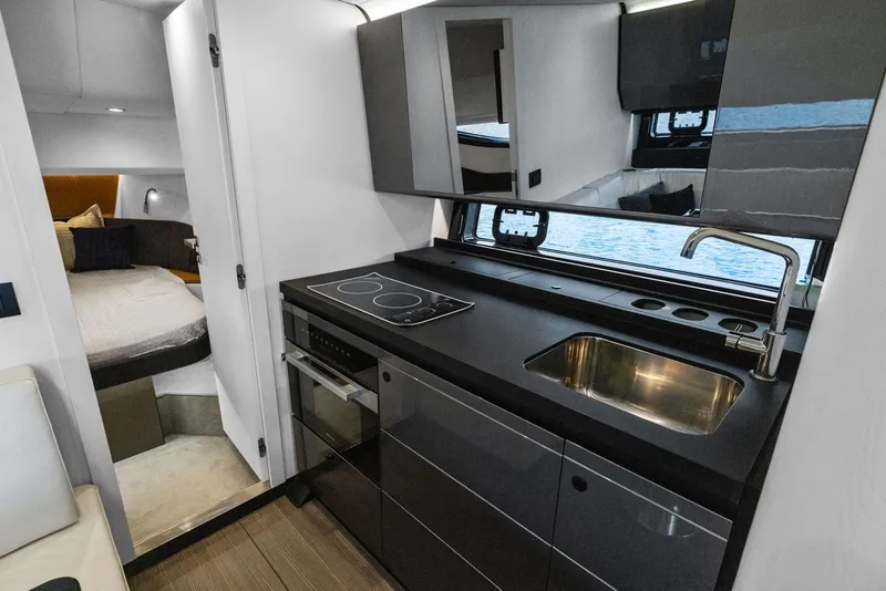 Slide: The Image of Luxurious interior of 2022 Azimut Verve 47 yacht with modern kitchen and cozy bedroom. - 27