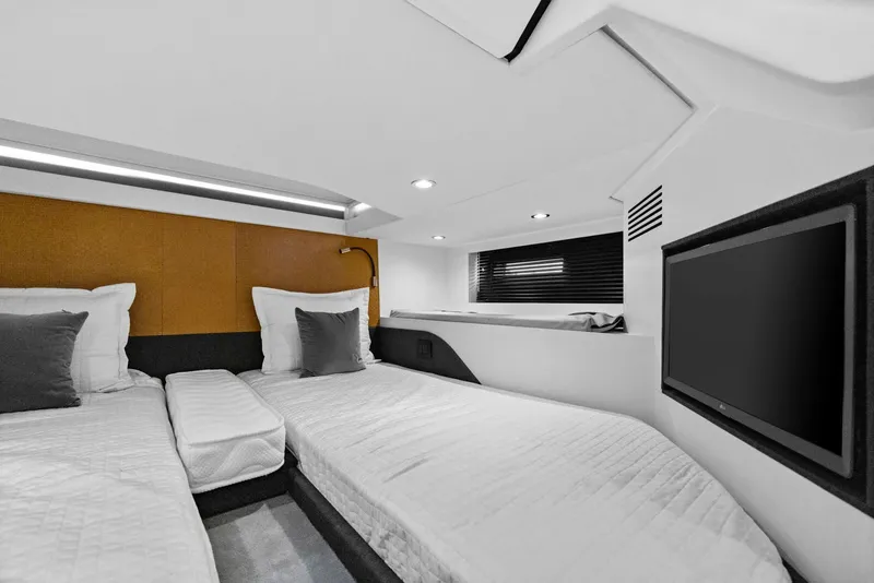 Slide: The Image of Interior of 2022 Azimut Verve 47 yacht cabin with twin beds and TV. - 28