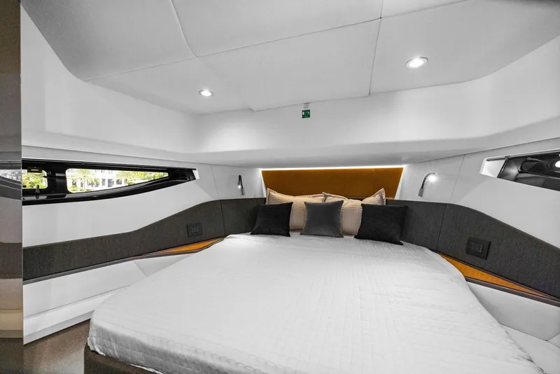 Slide: The Image of Luxurious interior cabin of 2022 Azimut Verve 47 yacht with modern design and cozy bedding. - 3