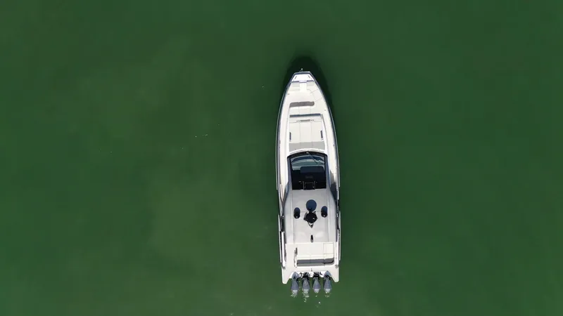 Slide: The Image of Aerial view of 2022 Azimut Verve 47 yacht on green water. - 31