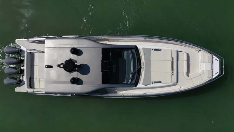 Slide: The Image of Overhead view of 2022 Azimut Verve 47 yacht on green water. - 34