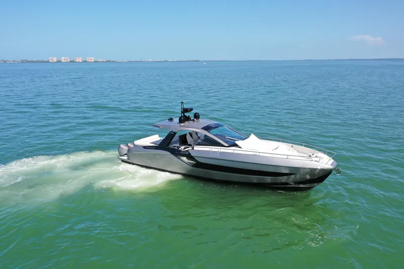 Slide: The Image of 2022 Azimut Verve 47 yacht cruising on open water under clear blue skies. - 36