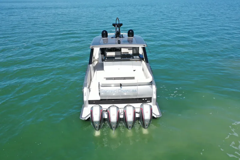 Slide: The Image of Azimut Verve 47 yacht, 2022 model, with four powerful outboard engines on open water. - 40