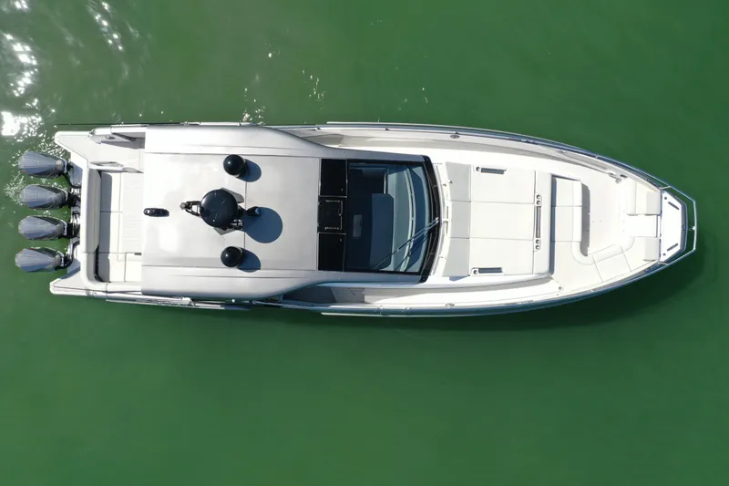 Slide: The Image of Overhead view of 2022 Azimut Verve 47 yacht on green water. - 42