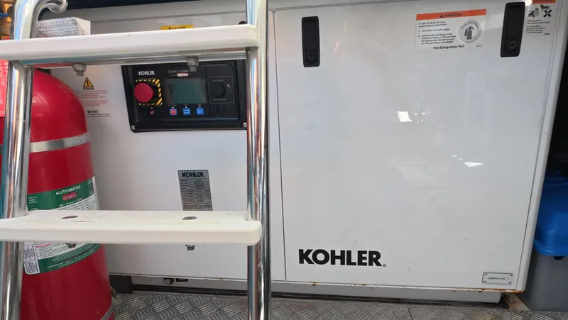 Slide: The Image of Engine room of 2022 Azimut Verve 47 with Kohler generator and fire extinguisher. - 43