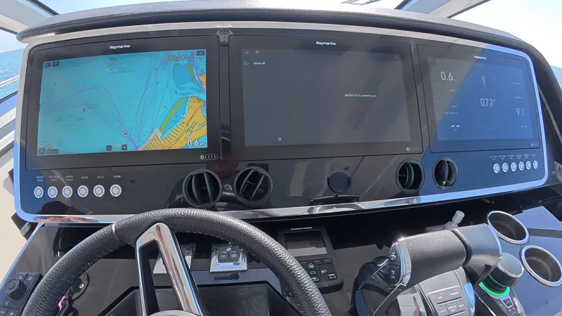 Slide: The Image of Helm of 2022 Azimut Verve 47 with advanced navigation displays and controls. - 8