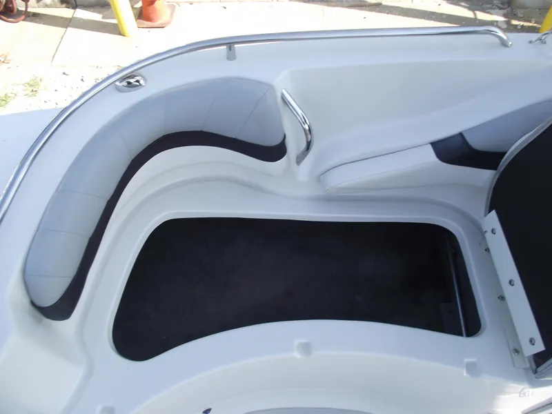 Slide: The Image of Interior seating of 2015 Starcraft Limited 2000 OB Fish boat, featuring white and black upholstery. - 13