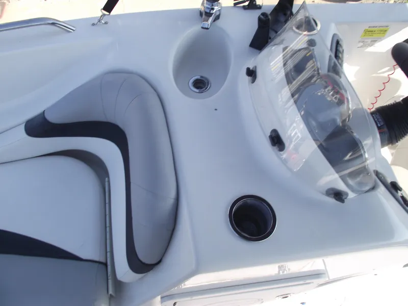 Slide: The Image of 2015 Starcraft Limited 2000 OB Fish boat interior with seating and control panel. - 14