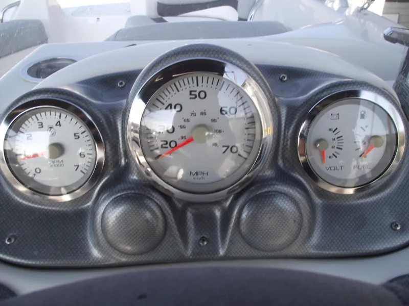 Slide: The Image of Dashboard of a 2015 Starcraft Limited 2000 OB Fish boat with speedometer and gauges. - 16