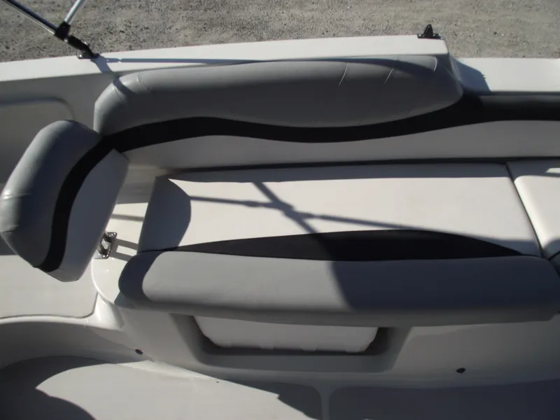 Slide: The Image of 2015 Starcraft Limited 2000 OB Fish boat interior with gray seating and white deck. - 20