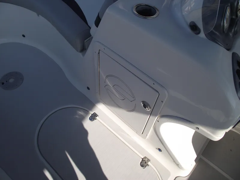 Slide: The Image of 2015 Starcraft Limited 2000 OB Fish boat interior, featuring storage compartment and seating area. - 22