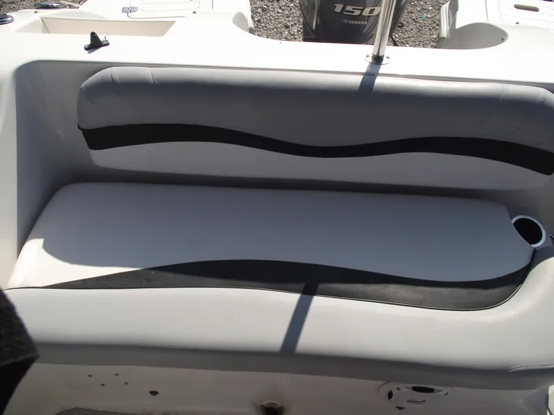 Slide: The Image of 2015 Starcraft Limited 2000 OB Fish boat seating with cup holder and Yamaha engine. - 24