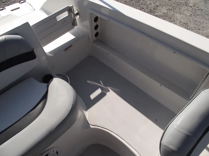 Slide: The Image of Interior of 2015 Starcraft Limited 2000 OB Fish boat, featuring seating and storage compartments. - 26