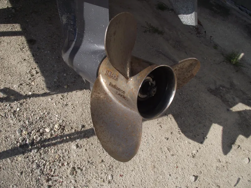 Slide: The Image of Propeller of a 2015 Starcraft Limited 2000 OB Fish boat on gravel surface. - 5