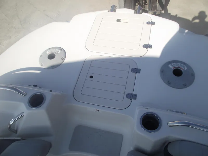 Slide: The Image of 2015 Starcraft Limited 2000 OB Fish boat deck with storage compartments and cup holders. - 6