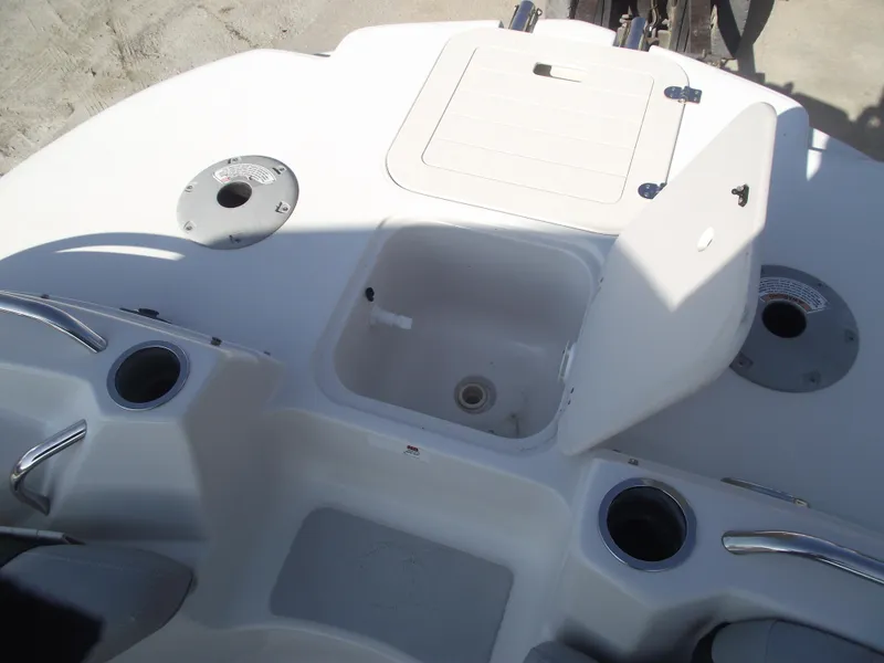 Slide: The Image of 2015 Starcraft Limited 2000 OB Fish boat interior with open storage compartment. - 7