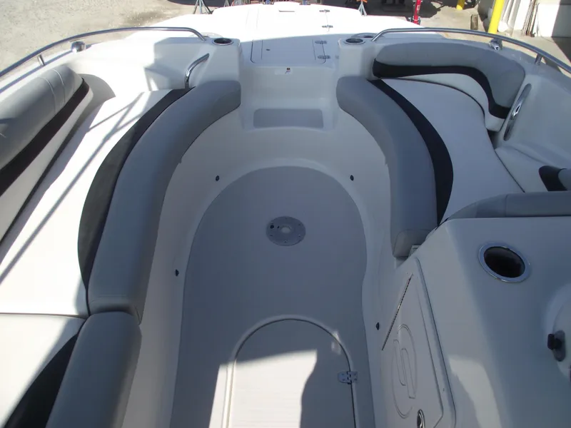 Slide: The Image of Interior view of 2015 Starcraft Limited 2000 OB Fish boat with cushioned seating. - 9