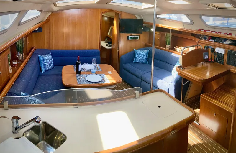 Slide: The Image of Luxurious interior of 2005 Hunter 41 AC yacht with cozy seating and dining area. - 17