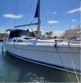Slide: The Image of 2005 Hunter 41 AC sailboat docked on a sunny day. - 2
