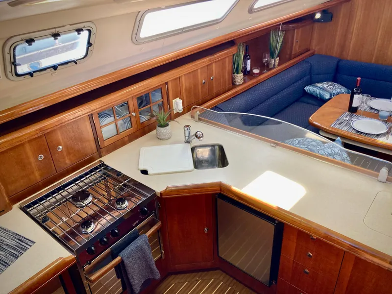 Slide: The Image of Luxurious 2005 Hunter 41 AC yacht interior with kitchen and dining area. - 27
