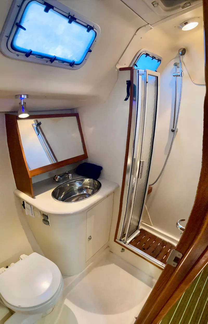 Slide: The Image of Compact bathroom in 2005 Hunter 41 AC yacht with shower, sink, and toilet. - 35