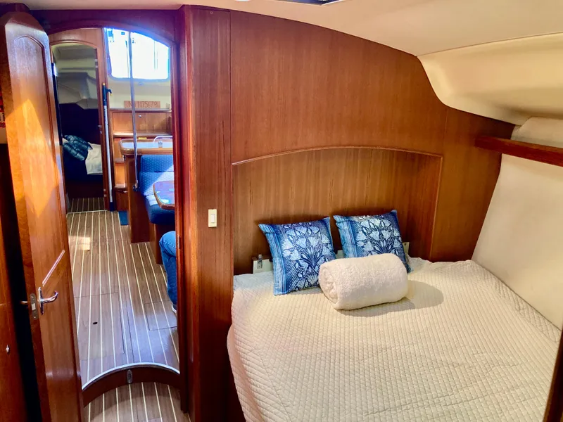 Slide: The Image of Luxurious interior of 2005 Hunter 41 AC yacht with cozy bedroom and elegant wood finish. - 38