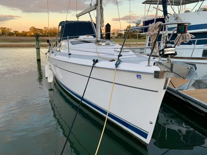 Slide: The Image of 2005 Hunter 41 AC sailboat docked at marina during sunset. - 4