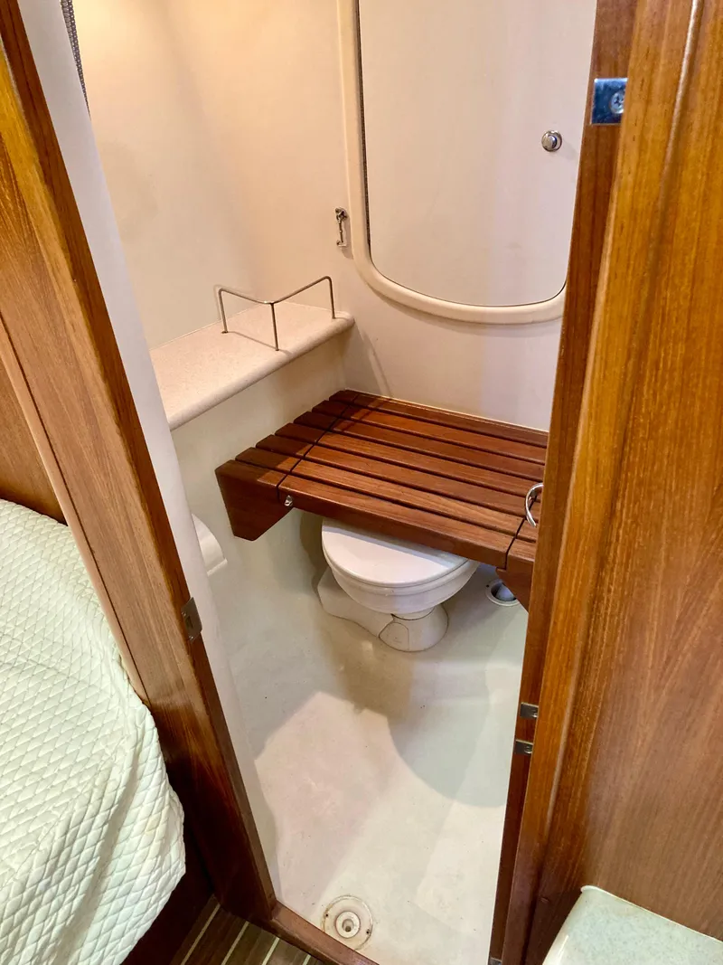 Slide: The Image of Compact bathroom in 2005 Hunter 41 AC sailboat with wooden seat over toilet. - 40