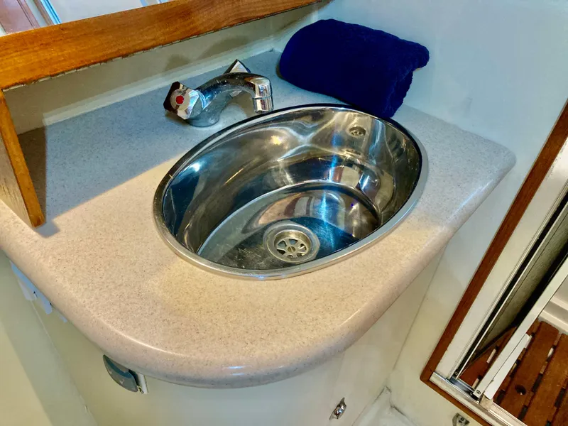 Slide: The Image of Stainless steel sink in 2005 Hunter 41 AC yacht bathroom. - 44