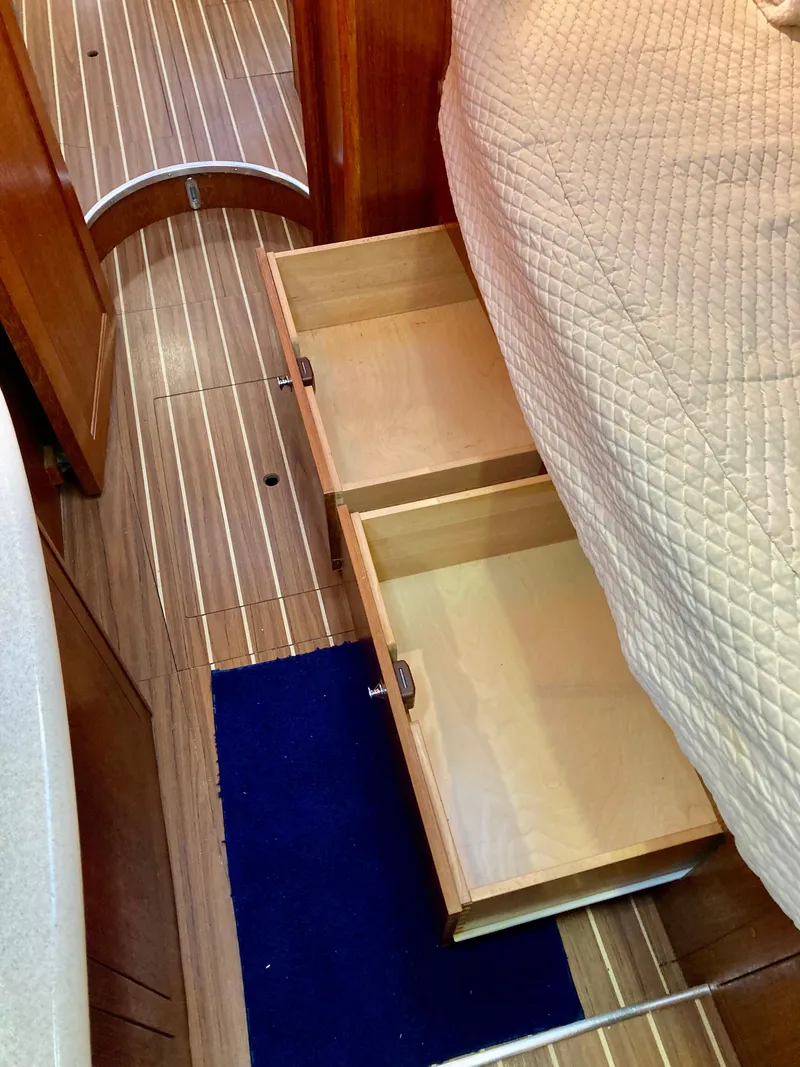 Slide: The Image of Wooden drawers under bed in 2005 Hunter 41 AC yacht interior. - 48