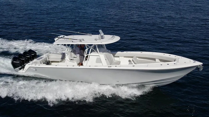 The Image of 2022 SeaVee 390z Center Console boat cruising on open water. - 0