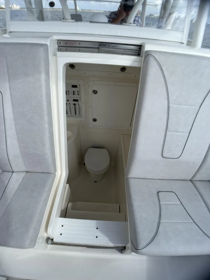 Slide: The Image of 2022 SeaVee 390z Center Console boat interior with hidden toilet compartment. - 18