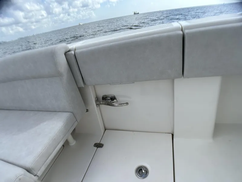 Slide: The Image of 2022 SeaVee 390z Center Console boat interior with gray seating and ocean view. - 26