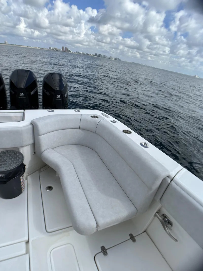 Slide: The Image of 2022 SeaVee 390z Center Console boat with ocean view and seating area. - 27