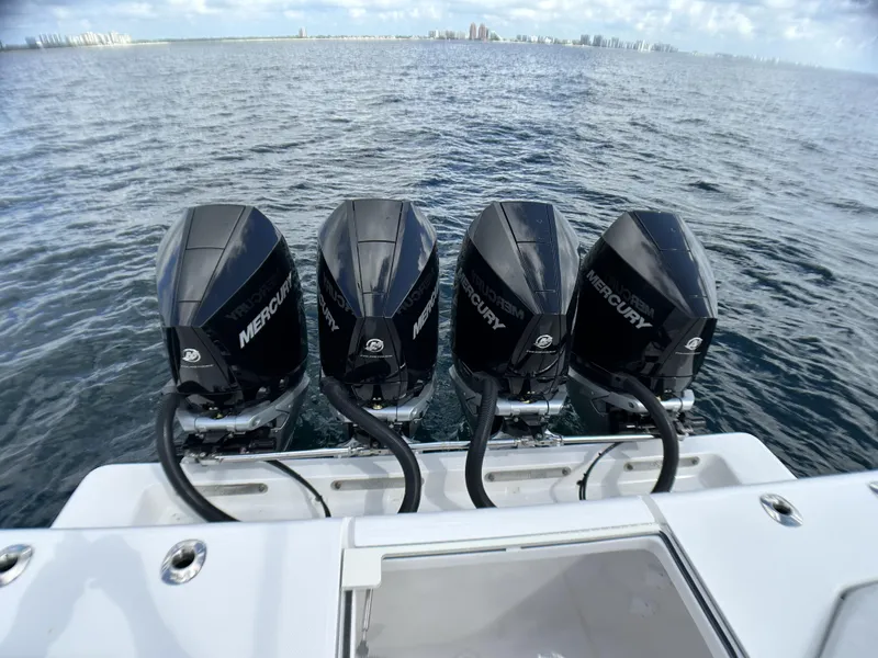 Slide: The Image of 2022 SeaVee 390z Center Console with four Mercury outboard engines on the water. - 29