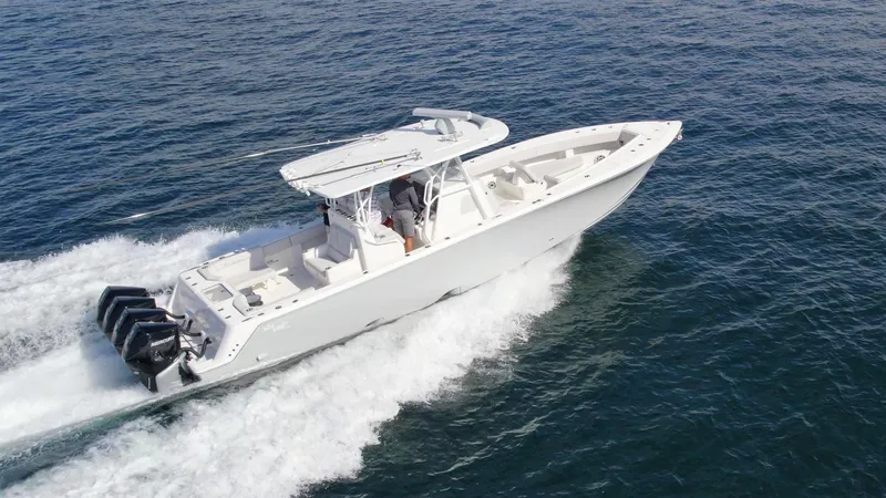 Slide: The Image of 2022 SeaVee 390z Center Console boat cruising on open water. - 3