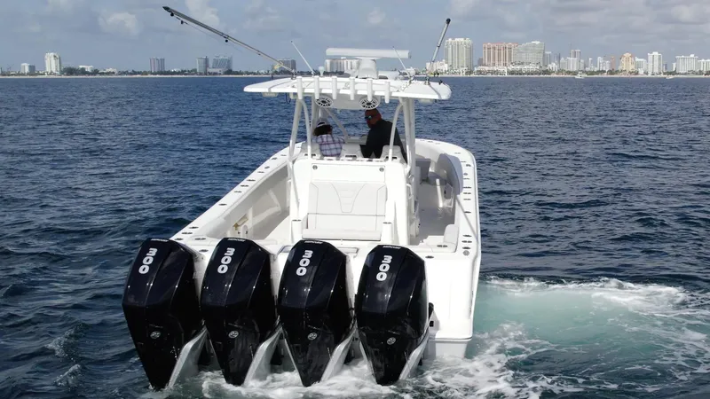 Slide: The Image of 2022 SeaVee 390z Center Console boat with quad outboard engines on the water. - 34