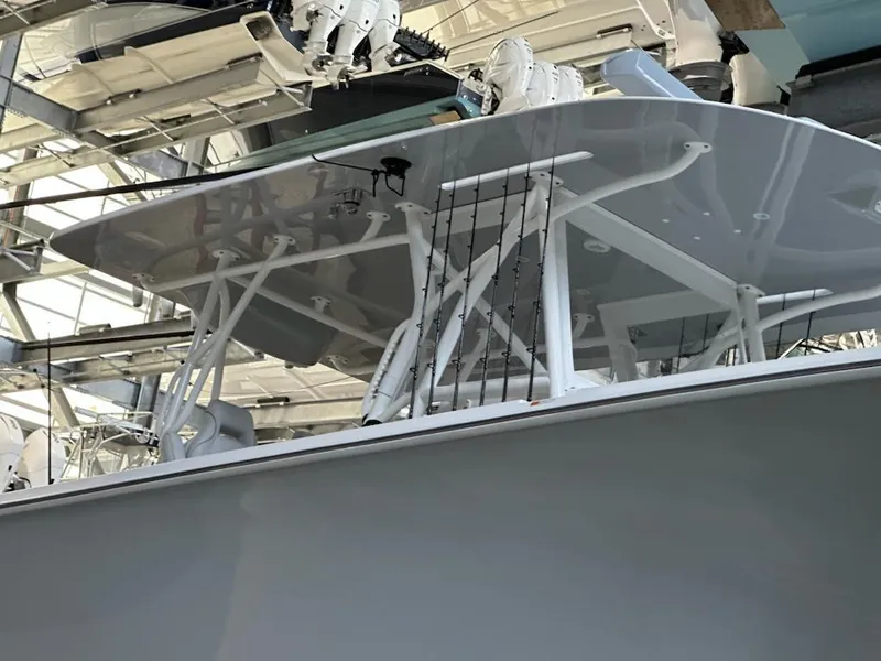 Slide: The Image of 2022 SeaVee 390z Center Console boat under a covered dock. - 38