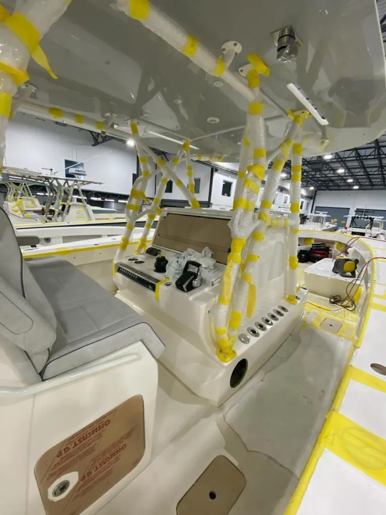 Slide: The Image of 2022 SeaVee 390z Center Console boat interior, partially wrapped for protection. - 39