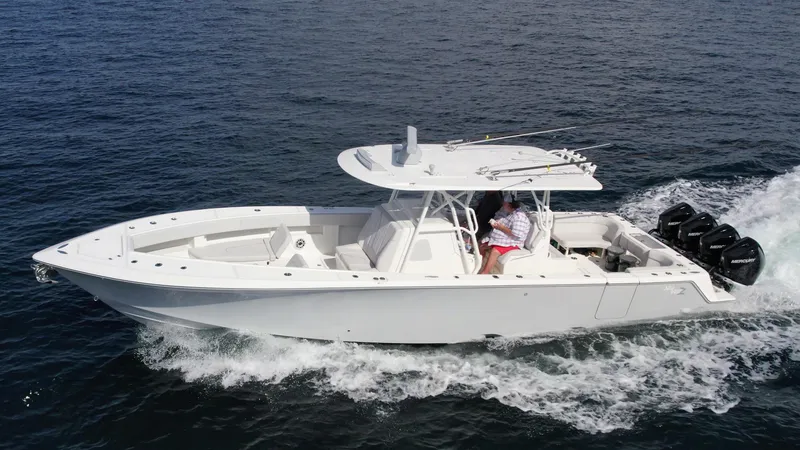 Slide: The Image of 2022 SeaVee 390z Center Console boat cruising on open water. - 4