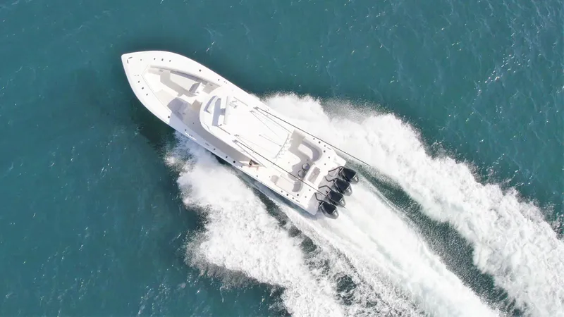 Slide: The Image of 2022 SeaVee 390z Center Console boat cruising on open water. - 42