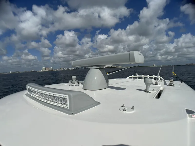 Slide: The Image of 2022 SeaVee 390z Center Console boat radar and light bar on open water. - 7