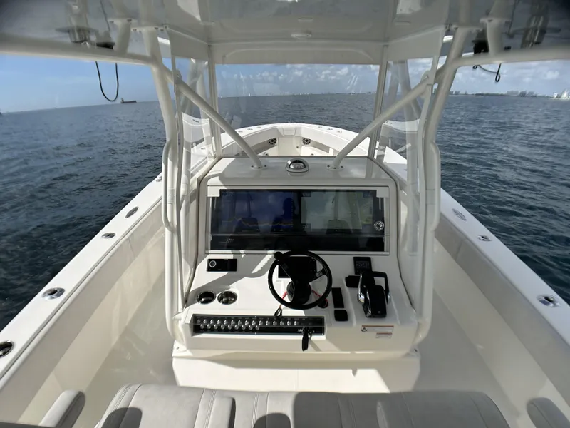 Slide: The Image of 2022 SeaVee 390z Center Console boat helm with ocean view. - 9